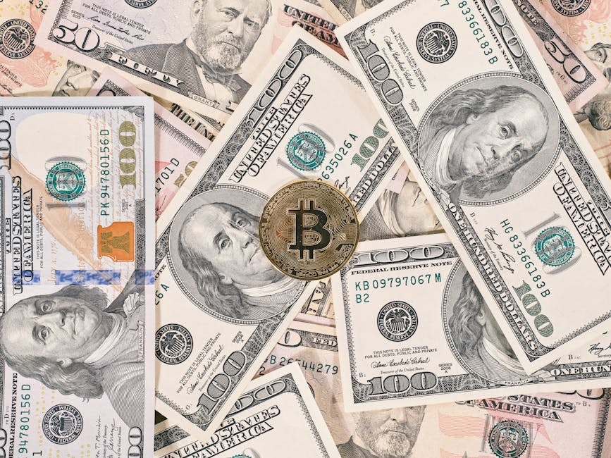 Bitcoin coin resting on a background of various US dollar bills, symbolizing the contrast between traditional and digital currency.